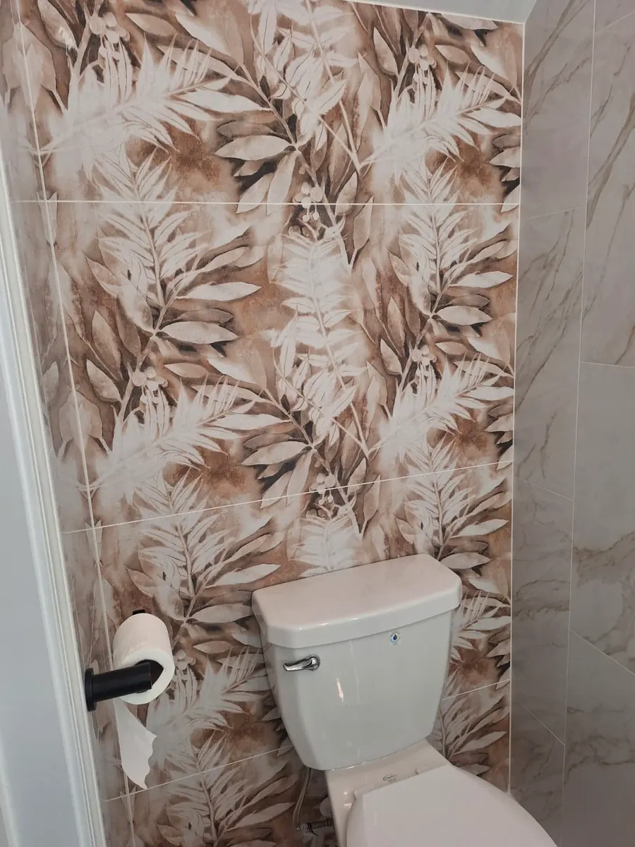 Bathroom feature wall with botanical pattern tile